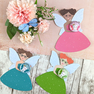 Three fairies with different colour dresses, skin colour and hair colour. Each holding matching badges.