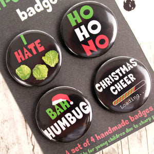 Close up of anti Christmas badges