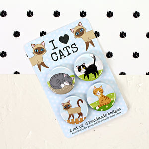 Set of four cat badges
