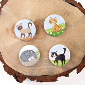 Four cute cat badges