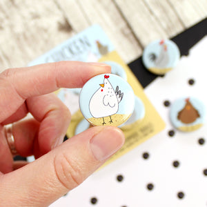 White and grey chicken badge