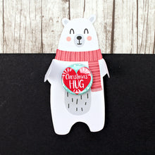 Load image into Gallery viewer, White polar bear in a red scarf with a Christmas hug badge