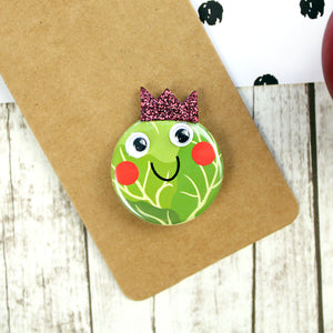 Sprout badge with googly wyes and crown