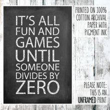 Load image into Gallery viewer, Math themed print with the words &#39;it&#39;s all fun and games until someone divides by zero&#39; on a wooden background
