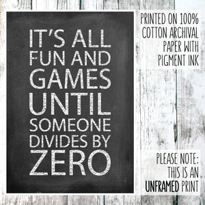 Math themed print with the words 'it's all fun and games until someone divides by zero' on a wooden background