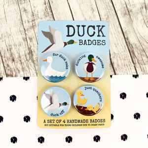 Duck badges with word puns