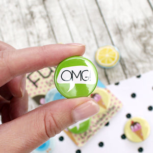 A white speech bubble with ‘OMG!’ and a green background