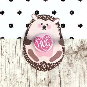 Cute pink and brown hedgehog with badge