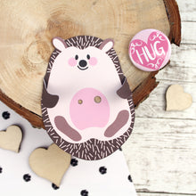 Load image into Gallery viewer, Pink and brown Hedgehog card backing with badge at the side