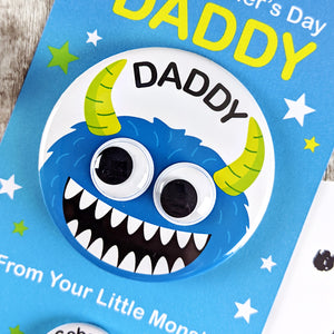 Close up of Daddy monster badge with googly eyes