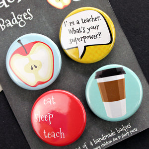 Close up of teacher badges