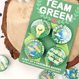 Close up of Team Green badges