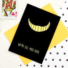 Load image into Gallery viewer, Yellow Cheshire Cat grin on black background